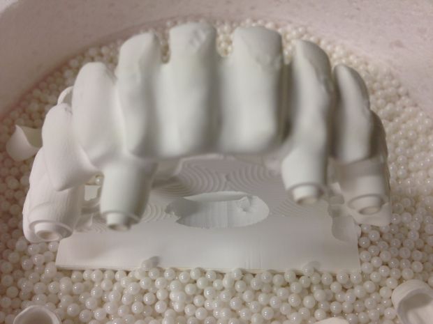 CAD/CAM zirconium frames, embedded in pearl powder before sintering-2