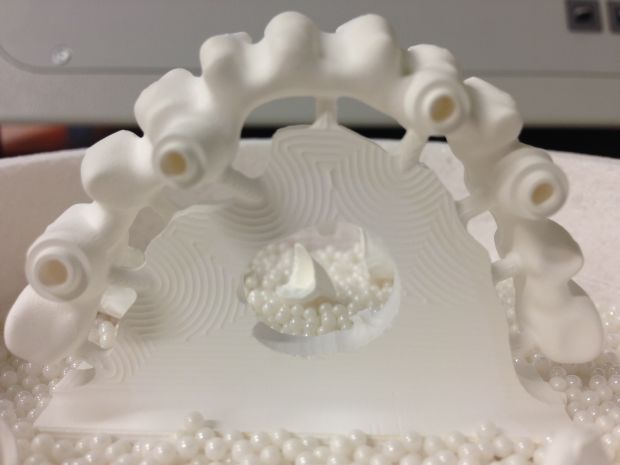 CAD/CAM zirconium frames, embedded in pearl powder before sintering-4